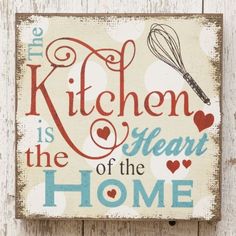 a sign that says the kitchen is the heart of the home on a wooden wall