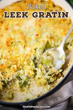 baked leek gratin in a white casserole dish with a serving spoon