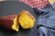 a close up of a piece of food on a plate with a cloth in the background