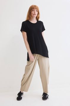 Asymmetric silhouettes are trending for the new season. Make this casual yet stand out piece your new closet staple. Dress up with the Wide-Ish pants, or pair with the some denim for a more laid-back vibe. Relaxed Fit Top With Asymmetrical Hem For Workwear, Workwear Top With Relaxed Fit And Asymmetrical Hem, Casual Asymmetrical Tops For Work, Chic Viscose Tops With Asymmetrical Hem, Chic Tops With Side Slits For Spring, Chic Viscose Top With Asymmetrical Hem, Chic Spring Tops With Side Slits, Trendy Tops With Asymmetrical Hem For Work, Casual Tops With Curved Hem For Work