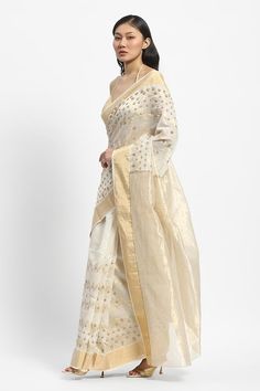 Ivory chanderi saree embroidered with golden threads and pearls. Comes with running blouse piece. - Aza Fashions Slub Silk Saree With Dori Work For Eid, Off White Tissue Silk Traditional Wear With Dupatta, Eid Slub Silk Saree With Dori Work, Festive Off White Tussar Silk Dupatta, Eid Dori Work Slub Silk Saree, Elegant Traditional Wear With Dori Work For Puja, White Traditional Wear With Resham Embroidery For Celebration, Traditional Saree In Slub Silk With Dori Work, Off White Tussar Silk Dupatta With Zari Work