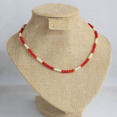 Individually crafted with care, this handmade traditional Indian necklace features a combination of coral beads and pearls that provides an elegant aesthetic with a beautiful, natural color, complementing any skin tone. Measuring 18 inches in length, this unique piece showcases the artistry of 3mm Italian coral and pearls. The single line of coral beads adds a touch of chicness, making it versatile enough to pair with various outfits. Additionally, I've designed another necklace with even more I Traditional Pearl Necklaces With Colorful Beads, Hand-strung Pearl Necklace For Gift, Pearl Beaded Necklaces Hand-strung For Gift, Adjustable Single Strand Beaded Necklace In Red Coral, Coral Beaded Pearl Necklace As Gift, Orange Pearl Necklace As A Gift, Orange Pearl Necklace As Gift, Gift Coral Beaded Pearl Necklace, Red Pearl Beaded Necklace With Round Beads