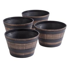 three wooden buckets sitting next to each other