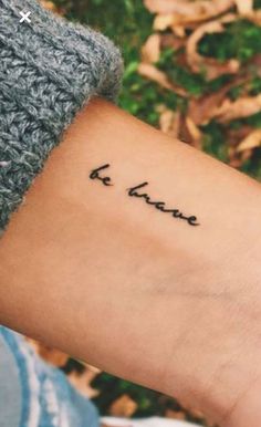 a person with a tattoo on their arm that says i love you in cursive writing