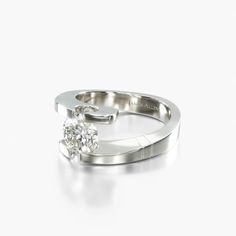 a white gold ring with a single diamond on the top and bottom, set against a plain background