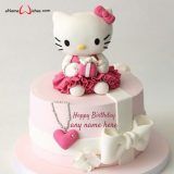 a hello kitty birthday cake with pink and white decorations