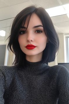 Woman with short black hair and bright red lipstick wearing a dark sweater in an office. Bob Hairstyles Women, Collarbone Bob, Dream Haircut, Black Hair Bob, Bob Pendek, Straight Across Bangs, Black Bob Hairstyles, Textured Layers, Bangs With Medium Hair