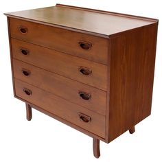 a wooden dresser with four drawers on one side