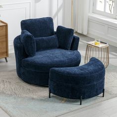 a blue chair and ottoman in a living room