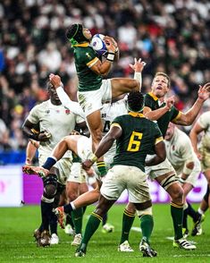 rugby players in action on the field during a game