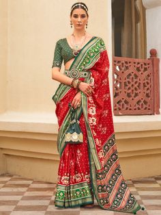 Introducing our fabulous red patola printed silk wedding wear saree with a blouse! This stunning saree is designed with a traditional look that is perfect for weddings, festivals, and other special occasions. Made from high-quality silk material, it features a vibrant red color that is sure to make a statement wherever you go.
Whether you're attending a wedding or a festival, this saree is designed to enhance your overall look and make you stand out from the crowd. The patola printed work all ov Patola Print, Wedding Wear Saree, Latest Indian Saree, Indian Sarees Online, Print Saree, Art Silk Sarees, Printed Art, Wear Saree, Silk Wedding