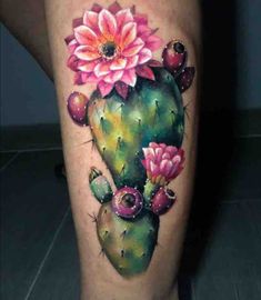 a cactus with pink flowers on it's thigh