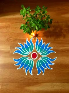 a potted plant sitting on top of a wooden floor