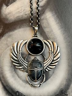 SCARAB ONYX NECKLACE Sterling Silver, Ancient Egyptian Beetle Amulet, Rebirth The scarab necklace with onyx combines two powerful symbols with rich histories and meanings. The scarab was a sacred symbol in ancient Egyptian mythology, representing the idea of rebirth and transformation. Scarabs were often used in funerary art and burial practices to symbolize the deceased person's journey to the afterlife and their transformation into a new form of existence. The scarab was also associated with t Egyptian Beetle, Ancient Egyptian Mythology, Egypt Jewelry, Ancient Egyptian Jewelry, Egyptian Scarab, Scarab Beetle, Egyptian Mythology, Egyptian Jewelry, Onyx Necklace