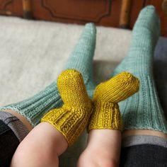 the legs of a woman wearing yellow socks