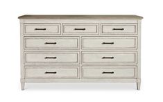 an old white dresser with drawers and black marble top on the bottom drawer, against a white background