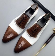 Elevate your shoe game with these bespoke leather handmade shoes. Made with genuine leather, these oxfords come in Brown & White , and are available in all US, UK, EU, and AU sizes. The comfortable insole and standard shoe width make them perfect for any occasion. Designed with a solid pattern and lace-up closure, these handmade shoes are a vintage addition to any wardrobe. The leather outsole adds durability and longevity to these unique boots. Customize them to your liking with personalization options available. Get ready to step out in style with these one-of-a-kind handmade leather shoes. White Leather Oxford Shoes With Leather Sole, White Oxford Leather Shoes With Cap Toe, White Cap Toe Dress Shoes For Business, White Leather-lined Dress Shoes For Business, White Wingtip Oxfords With Leather Lining, White Cap Toe Shoes For Derby, White Leather Cap Toe Dress Shoes, White Cap Toe Leather Dress Shoes, Fur Sneakers