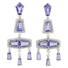 These beautiful drop earring are handcrafted in 14-karat gold. It is set with 7.72 carats tanzanite and 1.05 carats of diamonds. FOLLOW MEGHNA JEWELS storefront to view the latest collection & exclusive pieces. Meghna Jewels is proudly rated as a Top Seller on 1stDibs with 5 star customer reviews. All items manufactured by us are handmade and can be customized or redesigned. Composition Size 45X17 MM Total Weight-10.28 Diamond Wt(Cts)-1.05 Tanzanite Wt(Cts)-7.72 Gold Dangle Earrings, Tanzanite Diamond, Diamond Dangle Earrings, Gold Diamond Earrings, Gold Earrings Dangle, Modern Earrings, Gold Jewelry Fashion, High Jewelry, Ear Jewelry