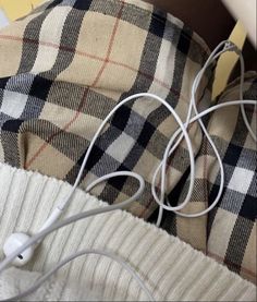 an ipod is plugged into the earbuds of someone's headphones