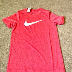 Size Medium New With Tags Nike University Red Crew Neck T-shirt, Nike Red T-shirt For Summer, Nike Casual Top In University Red, Nike Casual T-shirt In University Red, Red Nike T-shirt For Summer, Nike Short Sleeve Pre-shrunk Tops, Nike Red Sporty Tops, Nike Sporty Red Top, Red Moisture-wicking T-shirt For Summer