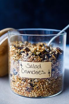 a jar filled with granola sitting on top of a table