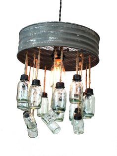 mason jar chandelier made from an old canister with hanging lights and jars