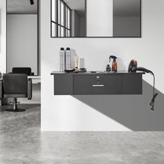 a hair salon with chairs and mirrors on the wall