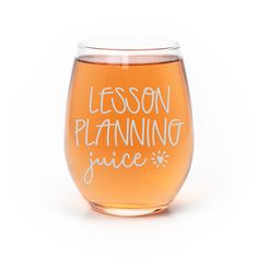 a glass filled with liquid that says lesson planning juice