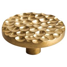 an image of a gold knob on a white background