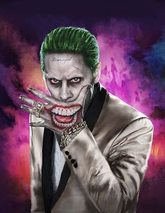 the joker is holding his hand up in front of him, while wearing a white suit and green hair