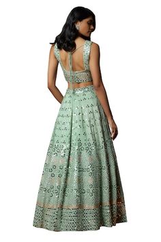 Sea green lehenga with an attached cancan and mirror and thread embroidery. Comes with a padded blouse and a dupatta. - Aza Fashions Designer Pista Green Choli With Sequins, Pista Green Sequined Choli For Designer Wear, Designer Pista Green Sequined Choli, Designer Pista Green Sequin Dress, Pista Green Sequined Dress, Anarkali Lehenga In Pista Green With Sequins, Anarkali Pista Green Lehenga With Sequins, Sleeveless Green Choli With Mirror Work, Festive Pista Green Sequin Dress