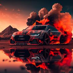 an audi car is on fire with mountains in the background