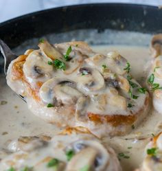 a skillet filled with meat covered in mushroom gravy