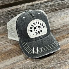 Support your fave wrestler in this comfy hat!  Distressed gray color with velcro closure Patch is sublimated and sewn onto hat Mom Hat, Wrestling Mom, Mom Hats, Trucker Cap, Lincoln, Caps Hats, Accessories Hats, Gray Color, Wrestling