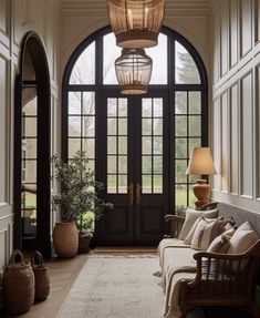 the entryway is decorated in neutral tones