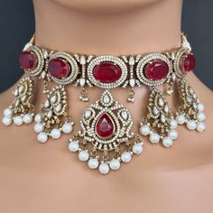 Ruby Victorian Kundan Necklace/Kundan Choker/Bollywood Jewelry/Indian wedding/Bridal jewelry/Indian Wedding/Pakistani/Punjabi This is 100% Handmade jewelry. So Color, shades, texture displayed may slightly vary from the actual product due to digital image limitations. We request you to consider these minor variations. Please expect the possibility of some slight imperfections when buying handmade jewelry. If you have any questions, please message or email us. Arrives in a gift box. Thank you so Ceremonial Kundan Necklace With Stone Work For Eid, Bollywood Style Heavy Lehenga For Eid, Kundan Necklace With Stone Work For Wedding And Eid, Bollywood Style Ceremonial Jewelry Sets For Festive Season, Bollywood Style Festive Ceremonial Jewelry Sets, Heavy Kundan Necklace For Ceremonial Occasions During Eid, Bollywood Chandbali Bridal Necklace For Wedding, Bollywood Bridal Chandbali Necklace For Wedding, Bollywood Style Bridal Necklace For Wedding