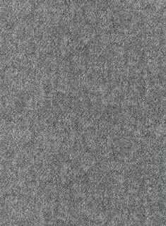 a gray carpet with small white dots on it