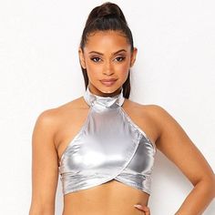 Dance From Planet To Planet With The Galactica Metallic Halter Top From Hot & Delicious. This Ultra Hot Rave Top Features A Silver Metallic Crop Style Halter Top With Zipper Closure In The Back And Loop Button Neck Closure. Throw On This Awesomely Cute Top And Take Over The Galaxy! Galactica Metallic Halter Top 100% Metallic Pu Cropped Fit Button & Loop Halter Closure Zipper Closure Up Back Silver Fitted Metallic Crop Top For Summer, Chic Fitted Metallic Crop Top, Fitted Metallic Summer Tops, Fitted Metallic Tops For Summer, Silver Stretch Top For Club, Silver Stretch Tops For Club, Silver Stretch Club Tops, Fitted Silver Tops For The Club, Silver Stretch Crop Top For Summer