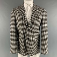 Marc Jacobs Sport Coat Comes In A Black White Houndstooth Wool Woven Material Featuring A Notch Lapel, Flap Pockets, Single Back Vent, And A Double Button Closure. Made In Italy.New With Tags. Marked: 48 Measurements: Shoulder: 17.5 Inches Chest: 38 Inches Sleeve: 25.5 Inches Length: 30.5 Inches Sui Generis Reference: 125647 Category: Sport Coat More Details Brand: Marc Jacobs Size: 38 Chest Size: 38 Gender: Male Color: Black Color 2: White Pattern: Houndstooth Fabric: Wool Style: Notch Lapel Ag Tailored Business Blazer With Houndstooth Pattern, Black Wool Blazer With Houndstooth Pattern, Formal Outerwear With Houndstooth Pattern And Suit Collar, Formal Houndstooth Outerwear With Suit Collar, Formal Houndstooth Pattern Outerwear With Suit Collar, Black Houndstooth Tweed Jacket For Formal Occasions, Black Business Tweed Jacket With Houndstooth Pattern, Black Houndstooth Tweed Jacket For Business, Fitted Houndstooth Sport Coat For Business Casual