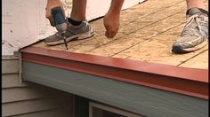 a pair of feet working on a roof