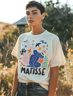 Abstract art shirt with Matisse Cut-outs inspired design. ♥️ Comfort Colors 1717 Garment dyed Unisex T-shirt ♥️ Soft, medium fabric (6.1 oz/yd² (206.8 g/m ♥️ Relaxed fit, unisex ♥️ 100% ring-spun cotton == RETURNS OR EXCHANGES == Since each shirt is custom printed to order, we are unable to accommodate returns or exchanges based on color or fit/size. However, if you have any issues with your shirt, please reach out to us, and will replace it ASAP. == SIZE == Please check the size guide in the im Graphic Tshirt Design Art, Artistic Oversized T-shirt With Graphic Print, Oversized Artistic Graphic Print T-shirt, Artistic Oversized T-shirt For Streetwear, Oversized Artistic Crew Neck T-shirt, Oversized Artistic Cotton T-shirt, Artsy Shirt, Tshirt Painting, Artist Tees