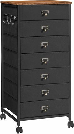 a black drawer with lots of drawers on it's sides and two metal handles