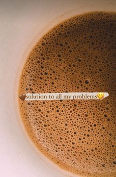 there is a message written on the bottom of a cup of coffee that says, solution to all my problems