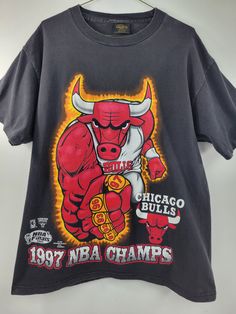 "1997 Bulls Ring Finger Tee Single stitch sleeves. Changes Tag Pit to pit: 22\" Top to bottom: 28\" This is an actual vintage (used) item and can show signs of wear. Please inspect all pics to insure you are satisfied with condition before buying.   Happy to answer any questions. IG: @hulapopper.vintage" Cheap 90s Sports T-shirt, Vintage Nba Shirt, Chigago Bulls, Basketball Streetwear, Bulls T Shirt, 90s Culture, Basketball Vintage, Nba T Shirts, Vintage Nba