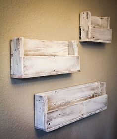 two wooden shelves mounted to the side of a wall