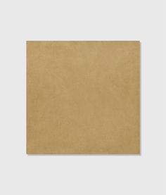 a brown square piece of paper on a white background