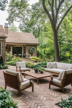 an outdoor living area with chairs and tables