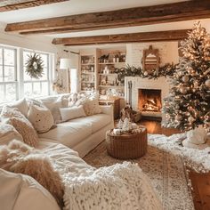 a living room filled with furniture and a christmas tree in front of a fire place