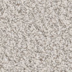 a close up view of the texture of a carpet with white and gray colors on it