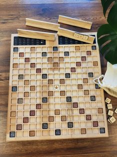 a wooden board game set up on top of a table